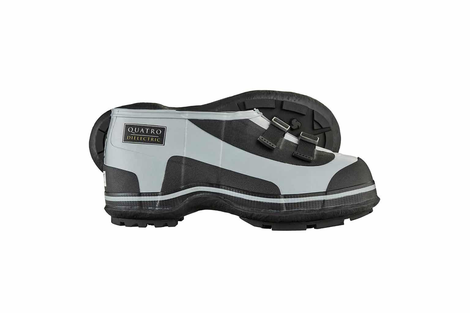 A pair of black and gray FRO4 Series Quatro Dielectric 2 Buckle Overshoes with reinforced soles and metal buckles. Designed for protection against electrical hazards, the shoes are shown side by side, highlighting their sturdy design.